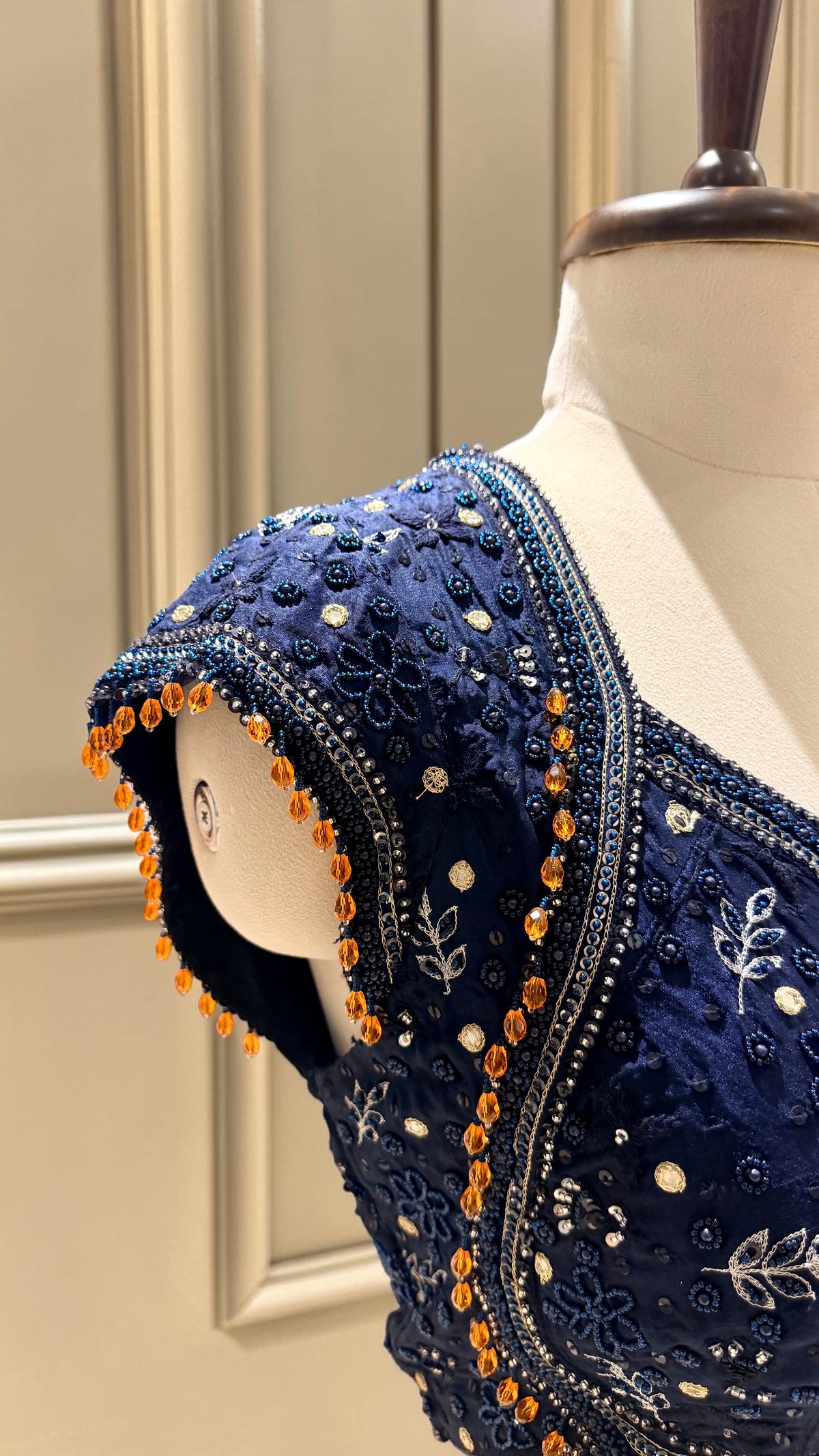 Embellished blouse with contrast tassels