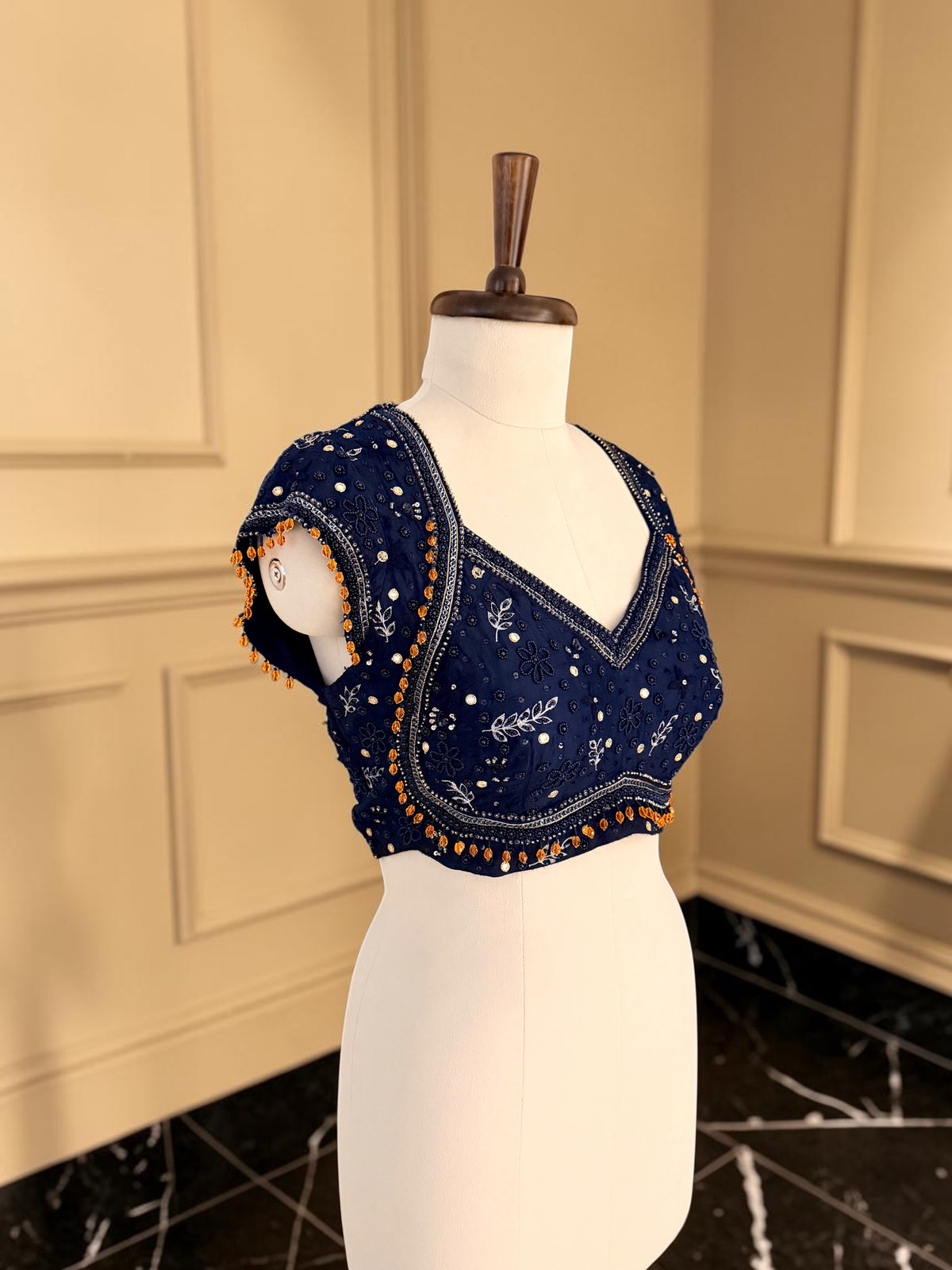 Embellished blouse with contrast tassels