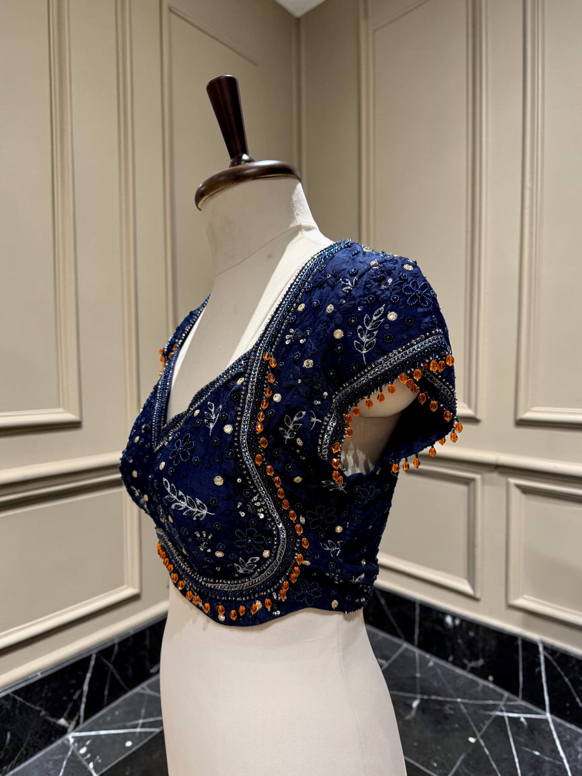 Embellished blouse with contrast tassels